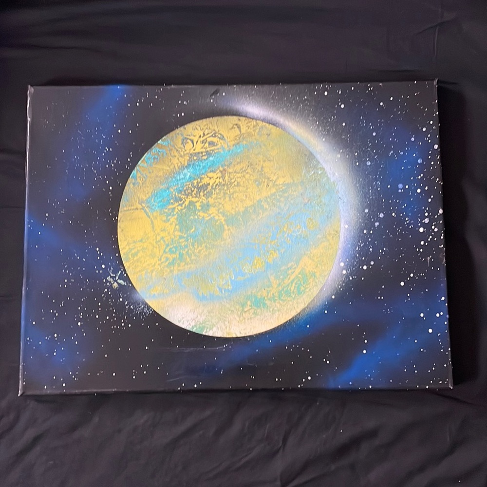 Spray paint art yellow and baby blue planet